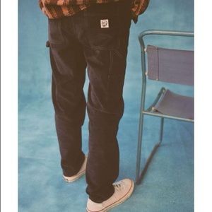 BDG painter pants black corduroy unisex size L has a small inseam repair needed